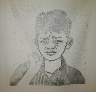 Lino block of young boy by Claire Passmore