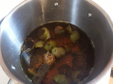 Walnut fruit drupes in a saucean ready to simmer